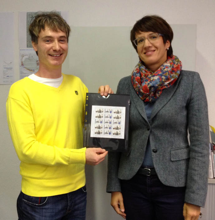 Brendan Jamison presents a sheet of Commemorative stamps to the Director of the Allied Museum, Berlin